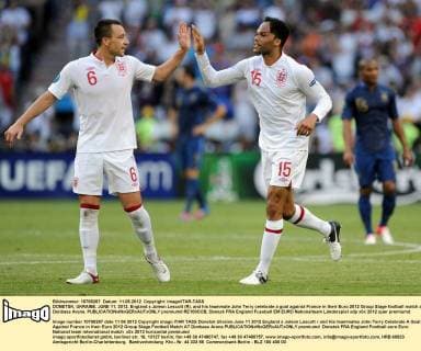 DONETSK, UKRAINE. JUNE 11, 2012. England s Joleon Lescott (R), and his teammate John Terry celebrate a goal against France in their Euro 2012 Group Stage football match at Donbass Arena.  premiumd RE100CCB