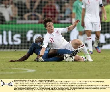 Frances Alou Diarra tussles with Englands Scott Parker..Euro 2012 France v England, Donetsk, Donbass Arena on the 11th June 2012. Pic David Klein SPORTIMAGE... EDITORIAL USE ONLY. No use with unauthorised audio, video, data, fixture lists, club league logos or live services. Online in-match use limited to 120 images, no video emulation. No use in betting, games or single club league player publications.