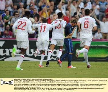 Football - UEFA Euro 2012 - France vs. England Frank Ribery of France looks dejected as the England players celebrate Joleon Lescott s goal at the Donbass Arena, Donetsk, Ukraine 