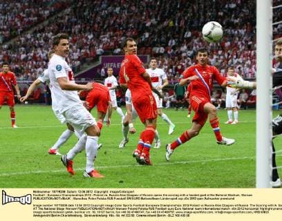 Football - European Championships 2012 - Poland vs. Russia Alan Dzagoev of Russia opens the scoring with a headed goal at the National Stadium, Warsaw 