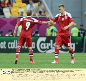 LVIV, June 13, 2012 -- Nicklas Bendtner (R) of Denmark celebrates with his teammate Michael Krohn-Dehli after scoring during the Group B 2nd round match against Portugal in Lviv, Ukraine, June 13, 2012. (Xinhua Ma Ning) (jyc) UKRAINE-LVIV-EURO 2012 FOOTBALL CHAMPIONSHIPS-DENMARK VS PORTUGAL 