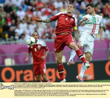 LVIV, June 13, 2012 -- Helder Postiga (R) of Portugal vies with Daniel Agger of Denmark during their Group B 2nd round match in Lviv, Ukraine, June 13, 2012. (Xinhua Ma Ning) (jyc) UKRAINE-LVIV-EURO 2012 FOOTBALL CHAMPIONSHIPS-DENMARK VS PORTUGAL 