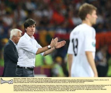 Germany s head coach Joachim Loew reacts during the Group B 2nd round match against Netherlands at the Euro 2012 football championships in Kharkiv, Ukraine, June 13, 2012. Germany won 2-1. (Xinhua Meng Yongmin) (jyc) UKRAINE-KHARKIV-EURO 2012 FOOTBALL CHAMPIONSHIPS-NETHERLANDS VS GERMANY 
