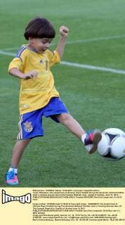 Tymur Shamanov, the instant face of Ukraine, plays football during the Ukrainian national football team s training session held at the Dynamo Stadium, Kyiv, capital of Ukraine, June 13, 2012. - 