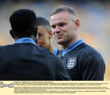 Football - European Championships 2012 Football - European Championships 2012 - England Training Wayne Rooney of England chats to Daniel Sturridge during training at the Olympic Stadium, Kiev, Ukraine 