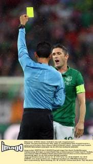 Football - European Championships 2012 - Spain vs. Ireland Robbie Kean of Ireland receives a yellow card at the Baltic Arena, Gdansk 