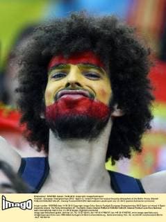 Football - European Championships 2012 - Spain vs. Ireland A Spain fan enjoys the party atmosphere at the Baltic Arena, Gdansk 