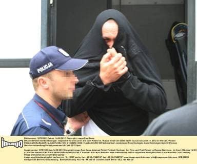 Detained Polish football hooligan, resposible for riots prior and post Poland vs. Russia match are taken taken to court on June 14, 2012 in Warsaw, Poland  EN_01033450_0020