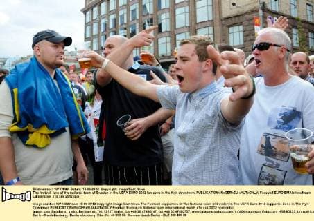 The football fans of the national team of Sweden in the UEFA EURO 2012 fan zone in the Kyiv downtown. 