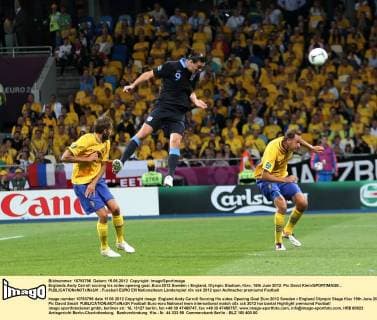 Englands Andy Carroll scoring his sides opening goal..Euro 2012 Sweden v England, Olympic Stadium, Kiev, 15th June 2012. Pic David Klein SPORTIMAGE... EDITORIAL USE ONLY. No use with unauthorised audio, video, data, fixture lists, club league logos or live services. Online in-match use limited to 120 images, no video emulation. No use in betting, games or single club league player publications.