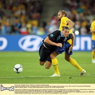 Swedens Olof Mellberg tussles with Englands Andy Carroll..Euro 2012 Sweden v England, Olympic Stadium, Kiev, 15th June 2012. Pic David Klein SPORTIMAGE... EDITORIAL USE ONLY. No use with unauthorised audio, video, data, fixture lists, club league logos or live services. Online in-match use limited to 120 images, no video emulation. No use in betting, games or single club league player publications.