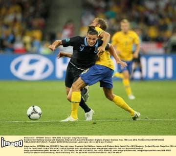 Swedens Olof Mellberg tussles with Englands Andy Carroll..Euro 2012 Sweden v England, Olympic Stadium, Kiev, 15th June 2012. Pic David Klein SPORTIMAGE EDITORIAL USE ONLY. No use with unauthorised audio, video, data, fixture lists, club league logos or live services. Online in-match use limited to 120 images, no video emulation. No use in betting, games or single club league player publications.