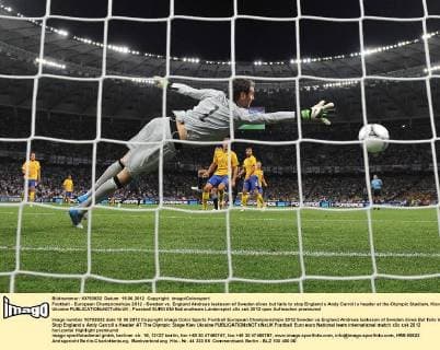 Football - European Championships 2012 - Sweden vs. England Andreas Isaksson of Sweden dives but fails to stop England s Andy Carroll s header at the Olympic Stadium, Kiev, Ukraine 