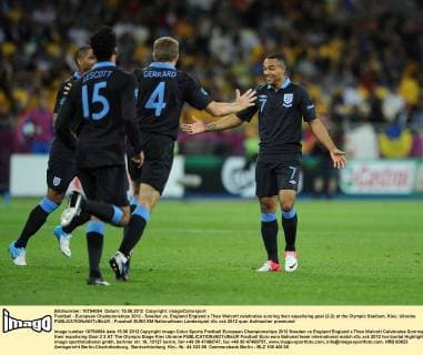 Football - European Championships 2012 - Sweden vs. England England s Theo Walcott celebrates scoring their equalising goal (2-2) at the Olympic Stadium, Kiev, Ukraine 
