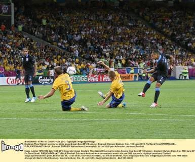 Englands Theo Walcott scoring his sides second goal..Euro 2012 Sweden v England, Olympic Stadium, Kiev, 15th June 2012. Pic David Klein SPORTIMAGE... EDITORIAL USE ONLY. No use with unauthorised audio, video, data, fixture lists, club league logos or live services. Online in-match use limited to 120 images, no video emulation. No use in betting, games or single club league player publications.