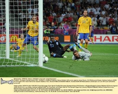 Football - European Championships 2012 - Sweden vs. England England s Danny Welbeck (22) scores against Jonas Olsson, Olof Melberg and Keeper Andreas Isaksson (SWE) the third goal with a back heal at the Olympic Stadium, Kiev, Ukraine 