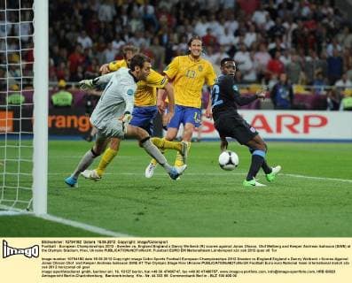 Football - European Championships 2012 - Sweden vs. England England s Danny Welbeck (R) scores against Jonas Olsson, Olof Melberg and Keeper Andreas Isaksson (SWE) at the Olympic Stadium, Kiev, Ukraine 