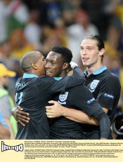 Englands Danny Welbeck celebrates scoring his sides third goal with Ashley Young and Andy Carroll - Euro 2012 Sweden v England, Olympic Stadium, Kiev, 15th June 2012. Pic David Klein SPORTIMAGE EDITORIAL USE ONLY. No use with unauthorised audio, video, data, fixture lists, club league logos or live services. Online in-match use limited to 120 images, no video emulation. No use in betting, games or single club league player publications.