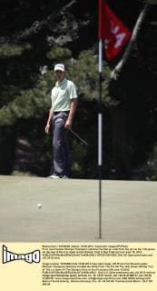 First round leader Michael Thompson watches his ball go wide from the pin on the 14th green on day two of the U.S. Open at the Olympic Club in San Francisco on June 15, 2012.  SFP2012061526