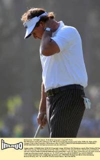 Phil Mickelson reacts after putting on the 16th green during the second round of the 112th U.S. Open at the Olympic Club in San Francisco, California on June 15, 2012.  SFP20120615349