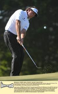Phil Michelson chips on the 15th green during the second round of the 112th U.S. Open at the Olympic Club in San Francisco, California on June 15, 2012.  SFP20120615355