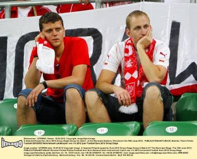 A dejected Poland fan..Euro 2012 Group Stage (Group A) match, at the Municipal Stadium, Wroclawon the 16th June 2012. EDITORIAL USE ONLY. No use with unauthorised audio, video, data, fixture lists, club league logos or live services. Online in-match use limited to 120 images, no video emulation. No use in betting, games or single club league player publications.