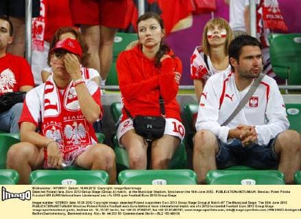Dejected Poland fans..Euro 2012 Group Stage (Group A) match, at the Municipal Stadium, Wroclawon the 16th June 2012. EDITORIAL USE ONLY. No use with unauthorised audio, video, data, fixture lists, club league logos or live services. Online in-match use limited to 120 images, no video emulation. No use in betting, games or single club league player publications.