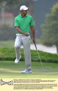 Tiger Woods reacts after missing a putt on the 16th green during the third round at the 112th U.S. Open at the Olympic Club in San Francisco, California on June 16, 2012.  SFP20120616106
