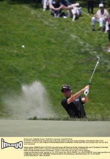 Ian Poulter of England hits out of the sand to the sixth green on day three of the U.S. Open at the Olympic Club in San Francisco on June 16, 2012.  SFP2012061636