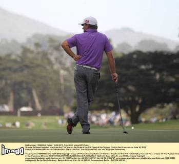 Graeme McDowell watches play from the 17th hole on day three of the U.S. Open at the Olympic Club in San Francisco on June 16, 2012.  SFP2012061641