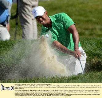 June 15, 2012 - San Francisco, CA, USA - Tiger Woods hits out of a bunker on to the 7th green during the third round of the U.S. Open golf tournament at the Olympic Club in San Francisco, California, on Saturday, June 16, 2012. U.S. Open at the Olympic Club - ZUMAm67