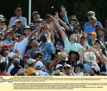 June 15, 2012 - San Francisco, CA, USA - Golf fans reach to grab a golf ball thrown by Ernie Els after Els made an eagle on the 17th hole during the third round of the U.S. Open golf tournament at the Olympic Club in San Francisco, California, on Saturday, June 16, 2012. U.S. Open at the Olympic Club - ZUMAm67