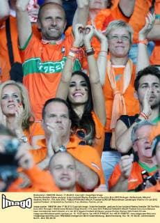 Yolanthe Sneijder-Cabau gestures to her husband Wesley Sneijder on the pitch..Euro 2012 Portugal v Netherlands, Metalist Stadium, Kharkiv, 17th June 2012. EDITORIAL USE ONLY. No use with unauthorised audio, video, data, fixture lists, club league logos or live services. Online in-match use limited to 120 images, no video emulation. No use in betting, games or single club league player publications.