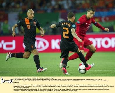 (L-R) Nigel de Jong of Holland,Gregory van der Wiel of Holland,Cristiano Ronaldo of Portugal Portugal v Netherlands Group B: UEFA EURO 2012 2011 2012 xVIxWillemxJanxDijkdrentxIVx 981831