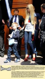 WARSAW, POLAND. JUNE 17, 2012. Maria, wife of Russia s forward Pavel Pogrebnyak, with son Artyom leave the Bristol Hotel. Russia failed to reach the Euro 2012 quaterfinal after losing 0-1 in a Group Stage match against Greece.  RE101585