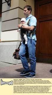 WARSAW, POLAND. JUNE 17, 2012. Russia s midfielder Konstantin Zyryanov with his baby daughter Polina leaves the Bristol Hotel. Russia failed to reach the Euro 2012 quaterfinal after losing 0-1 in a Group Stage match against Greece.  RE101582