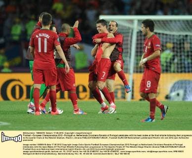 Football - European Championships 2012 - Portugal vs. Netherlands Christiano Ronaldo of Portugal celebrates with his team mates at the final whistle following their progression to the quarter finals at the Metalist Stadium, Kharkiv, Ukraine 