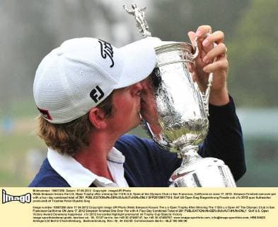 Webb Simpson kisses the U.S. Open Trophy after winning the 112th U.S. Open at the Olympic Club in San Francisco, California on June 17, 2012. Simpson finished one-over-par with a four day combined total of 281.  SFP20120617124