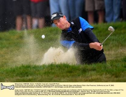 Jim Furyk hits out of a bunker on the 7th hole during the fourth round at the 112th U.S. Open at the Olympic Club in San Francisco, California on June 17, 2012.  SFP20120617111