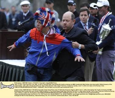 June 17, 2012 - San Francisco, CA, USA - A man is removed after interrupting the trophy ceremony as NBC broadcaster Bob Costas interviews golfer Webb Simpson of the United States, right, after winning the 2012 U.S. Open atThe Olympic Club in San Francisco, California, Sunday, June 17, 2012. U.S. Open at the Olympic Club - ZUMAm67