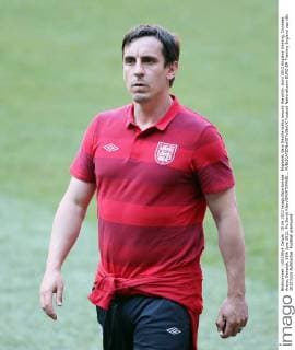Englands Gary Neville walks around the pitch..Euro 2012 England training, Donbass Arena, Donetsk, 18th June 2012. Pic David Klein SPORTIMAGE... EDITORIAL USE ONLY. No use with unauthorised audio, video, data, fixture lists, club league logos or live services. Online in-match use limited to 120 images, no video emulation. No use in betting, games or single club league player publications.