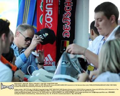 ITAR-TASS: DONETSK, UKRAINE. JUNE 19, 2012. Official fan shop with UEFA EURO 2012 souvenirs in the fanzone (fan zone).  RE101664