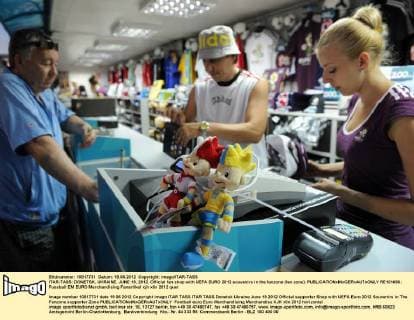 ITAR-TASS: DONETSK, UKRAINE. JUNE 19, 2012. Official fan shop with UEFA EURO 2012 souvenirs in the fanzone (fan zone).  RE101666