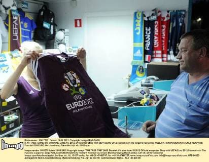 ITAR-TASS: DONETSK, UKRAINE. JUNE 19, 2012. Official fan shop with UEFA EURO 2012 souvenirs in the fanzone (fan zone).  RE101668