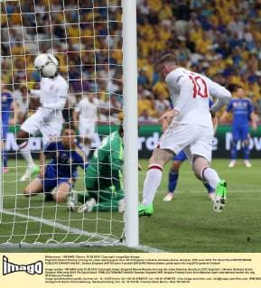Englands Wayne Rooney scoring his sides opening goal..Euro 2012 England v Ukraine, Donbass Arena, Donetsk, 19th June 2012. Pic David Klein SPORTIMAGE EDITORIAL USE ONLY. No use with unauthorised audio, video, data, fixture lists, club league logos or live services. Online in-match use limited to 120 images, no video emulation. No use in betting, games or single club league player publications.
