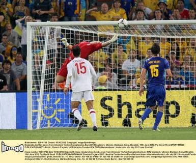 Englands Joe Hart saves from Ukraines Yevhen Konoplyanka..Euro 2012 England v Ukraine, Donbass Arena, Donetsk, 19th June 2012. Pic David Klein SPORTIMAGE EDITORIAL USE ONLY. No use with unauthorised audio, video, data, fixture lists, club league logos or live services. Online in-match use limited to 120 images, no video emulation. No use in betting, games or single club league player publications.