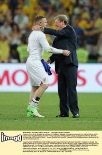 Football - Euro 2012 - England vs. Ukraine Roy Hodgson, Manager of England celebrates with Wayne Rooney as the players leave the pitch having won their final group game and topped their group, at the Donbass Arena, Donetsk, Ukraine 