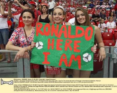 Football - European Championships 2012 - Portugal Female fans pose with a sign for Christiano Ronaldo of Portugal at the National Stadium, Warsaw 