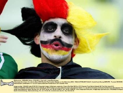 A Germany fan cheers his side on..Euro 2012 Quarter Final match, Gdansk, on the 22nd June 2012. EDITORIAL USE ONLY. No use with unauthorised audio, video, data, fixture lists, club league logos or live services. Online in-match use limited to 120 images, no video emulation. No use in betting, games or single club league player publications.