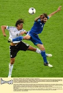 Sami Khedira (L) of Germany vies with Grigoris Makos of Greece during the quarterfinal match between Germany and Greece at the Euro 2012 football championships in Gdansk, Poland, June 22, 2012. (Xinhua Liu Lihang) (jyc) POLAND-GDANSK-EURO 2012 FOOTBALL CHAMPIONSHIPS-GERMANY VS GREECE 